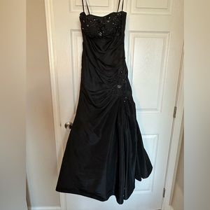Strapless, black taffeta mermaid style gown.